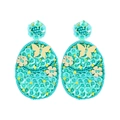 Bohemian Easter egg bead earrings in turquoise with gold butterfly and floral charms - Green