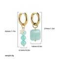 Detailed view of asymmetric earrings showing size dimensions and green natural stones - Pale Green