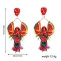 Détail de boucles d'oreilles homard en perles avec dimensions 97mm sur 44mm et 12,8g - Homard