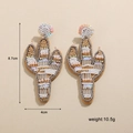 Détail de boucles d'oreilles cactus en perles faites main, dimensions 8,7cm et poids 10,5g - Cactus