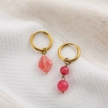 Asymmetric gold hoop earrings featuring natural pink stones in geometric dangle shapes - Watermelon red