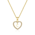 Close-up of golden hollow heart necklace with pavé zircon and letter C pendant - Letter G(G)