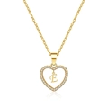 Macro shot of gold hollow heart pendant with micro-inlaid zircons and letter E - Letter E(E)