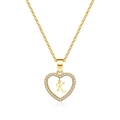 Macro shot of gold heart necklace with zircon inlay and letter K pendant on white background - Letter K(K)