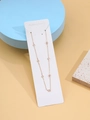Detalle de cadena de cuerpo en oro 14K con siete dijes triangulares de circonita clara - Collar Largo Strass Triángulo (XL0304_6)