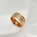 Detail of rose gold ring with double-row inlaid cubic zirconia on a white stand - US 5 / Rose Gold