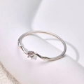 Macro detail of wave shaped silver ring featuring a small round sparkling zircon stone - US 5 / Single Stone Wave Style (B337) / Steel
