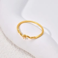 Minimalist wavy gold ring with a single round zircon stone on a white textured base - US 5 / Single Stone Wave Style (B337) / Gold