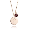 Detail of rose gold titanium necklace featuring lotus engraved pendant and red zircon stone - July Birth Flower Style (B388)