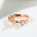 Macro shot of rose gold butterfly and zircon stacked rings with matte finish - US 5 / Rose Gold