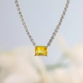 Macro view of a rectangular yellow zircon pendant on a sparkling silver tennis necklace - Silver - Yellow Square Zirconia