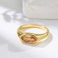 Macro shot of marquise-cut champagne crystal set in elegant gold titanium ring - US 7 / Gold with Champagne Zirconia