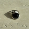 Detail of vintage signet ring with oval black onyx gemstone in silver titanium steel - US 6 / Silver Black Onyx