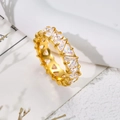 Detail of gold plated ring featuring triangle cut zircons in a luxury claw setting - US 7 / Triangle White Rhinestone Gold