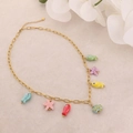 DIY golden necklace with colorful ceramic fish and star charms in dopamine fashion style - Ocean Necklace