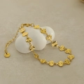 Elegant gold stainless steel heart pendant bracelet with radial engraving on white stand - Bracelet / Gold