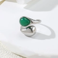 Detailed view of silver irregular open ring with green teardrop stone and metallic drop - US 6 / Silver+Green