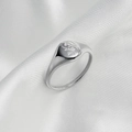 Close-up of a silver signet ring with sun and flower engravings on a white satin cloth - Silver Sunflower Style (C289)