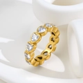Macro view of gold plated heart-shaped cubic zirconia eternity ring on artistic stand - US 7 / Gold Heart Rhinestone (C272)