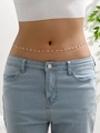 Detailed shot of golden waist chain with daisy charms and white beads on model - Daisy (YL0005_3)