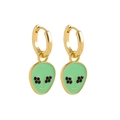 Detail shot of cute alien charm earrings with green enamel and black rhinestone eyes - Green Alien
