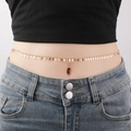 Close-up of gold waist chain featuring small cross charms worn over denim jeans - Cross (YL0005_6)