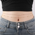 Close-up of double-layer gold waist chain with pearls on a model wearing jeans - Pearl Beads (YL0005_9)