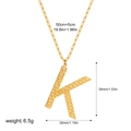 Detail of gold letter K pendant with hammered texture and paperclip chain dimensions - Letter K