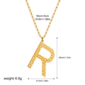 Detail of gold letter R pendant with hammered texture and measurement dimensions - Letter R