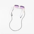 Detail of Y2K sunglasses with purple gradient lenses and black-and-white beaded chain - Black and White Seed Beads (GC077)
