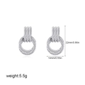 Detailed view of cable texture earrings with dimensions 22mm by 14mm on white backdrop - Twisted Circle Style / Fine Style / Silver