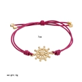 Rose red cord bracelet featuring a gold-toned nautical helm charm and adjustable closure - Rose Red Rudder