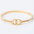 Elegant gold-plated stainless steel cuff bracelet with handcuff design and sparkling crystals - Gold