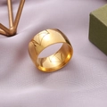 Polished 11mm wide gold stainless steel ring with geometric lines on silk background - US 7 / Gold