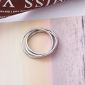 Minimalist stainless steel interlocking triple band ring set with a polished silver finish - US 5 / Triple Loop Style