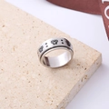 Rotating stainless steel spinner ring with black butterfly patterns on stone background - Number 5 / Butterfly Design / Steel