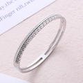 Polished stainless steel oval bangle with Greek fret pattern and crystal inlay detail - Steel
