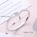 Brushed butterfly stainless steel oval bangle with crystal side accents for women - Frosted Butterfly (Silver Tone) / Steel
