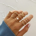 Macro detail of a 10-piece gold stacking ring set with pearls and textured bands - Gold Pearl Chain Geometric Ring 7-Piece Set (51185) / Gold