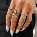 Silver ring set featuring butterfly designs and rhinestones for women on model hand - Silver Butterfly Wave Rhinestone Ring 7-Piece Set (5598302) / Silver