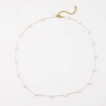 Elegant gold necklace featuring delicate white heart beads with adjustable lobster clasp - Small White Heart Faux Pearl Necklace
