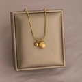 Golden titanium steel necklace featuring polished and frosted double bead pendants - Gold Double Solid Ball Necklace