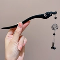Handcrafted black wooden hairpin with wave-shaped body and multi-layer tassel pendant - Calligraphy Peace Buckle Hair Stick