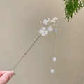 Elegant gold hair stick with translucent flower and delicate pearl tassel detail - Golden Branch Pearl Flower Tassel