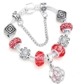 Silver snake chain bracelet with red crystal beads and a rose flower charm - 16cm / Red