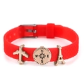 Red silicone travel bracelet with airplane and Eiffel Tower charms in gold finish - Plane Compass Tower Style(006)
