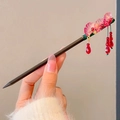 Sandalwood hair pin with pink peach blossoms and hanging red crystal tassels - Purple Ginkgo Leaf with Red Gem Style