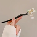 Black wavy wooden hair stick featuring white resin flowers and pearl tassel charm - White Jade Double Flower Dragon Style