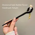 Sandalwood hairpin featuring a carved jade-like rabbit and flower tassel ornament - Jade Rabbit White Flower Yellow Tassel (17#)