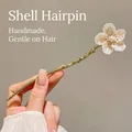Elegant gold-tone hair pin with white shell-style flower and a center pearl detail - Shell Flower Style (23#) / Gold